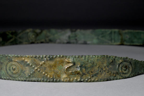 Ornamented sheet bronze belt with one end tapering to a hook from the Early Iron Age cemetery, Hallstatt, Austria (© Ashmolean Museum, AN1927.888)